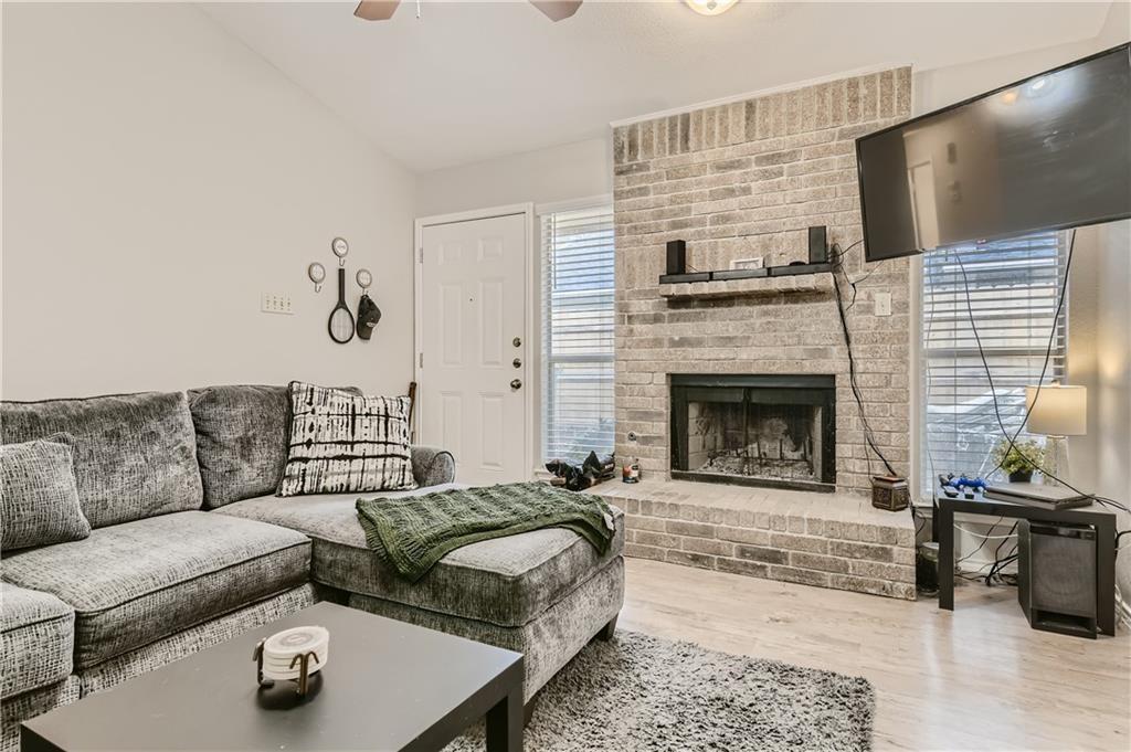 2126 Redwing Way Round Rock, TX 78664 - Photo 3 of 13 a living room with furniture and a fireplace
