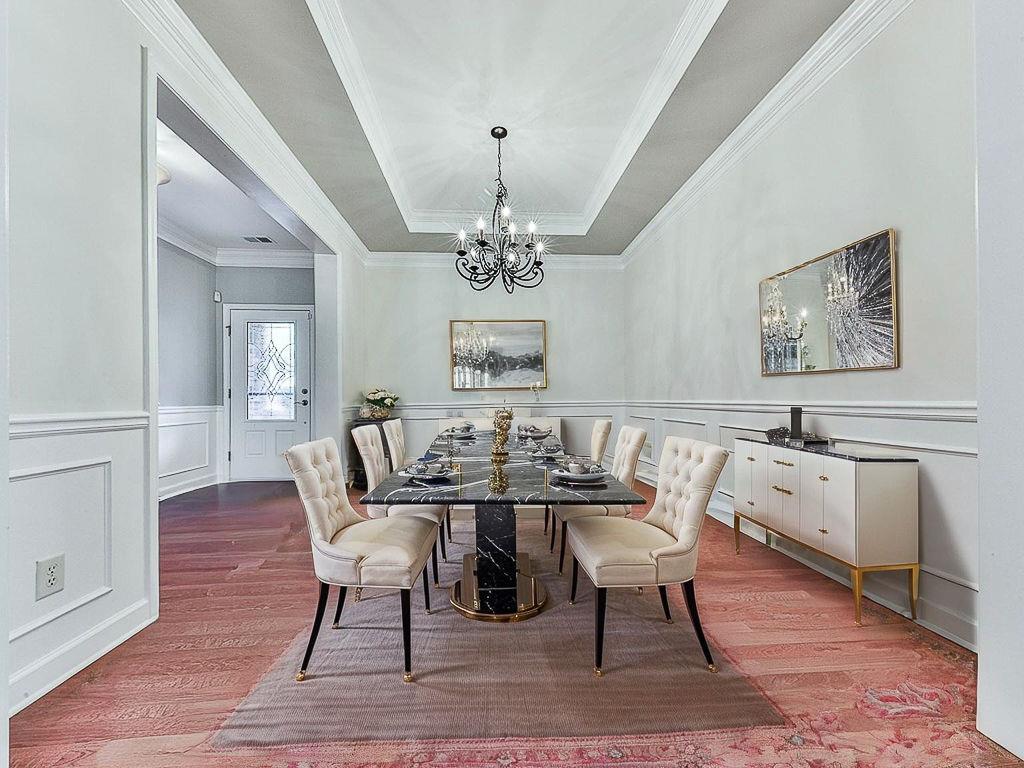 626 Laurel Crossing Canton, GA 30114 - Photo 10 of 77 a view of a dining room with furniture wooden floor and chandelier