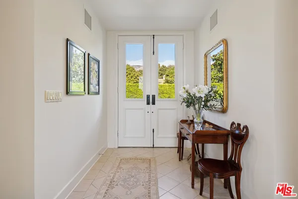 a view of a livingroom with furniture and a window
