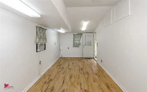 a view of wooden floor in an empty room