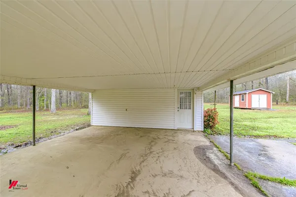 a view of a house with a backyard