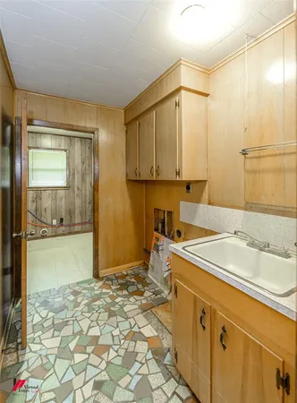 a bathroom with a sink a mirror and a shower