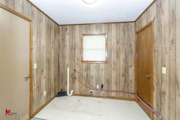 a view of a bathroom with tub and windows