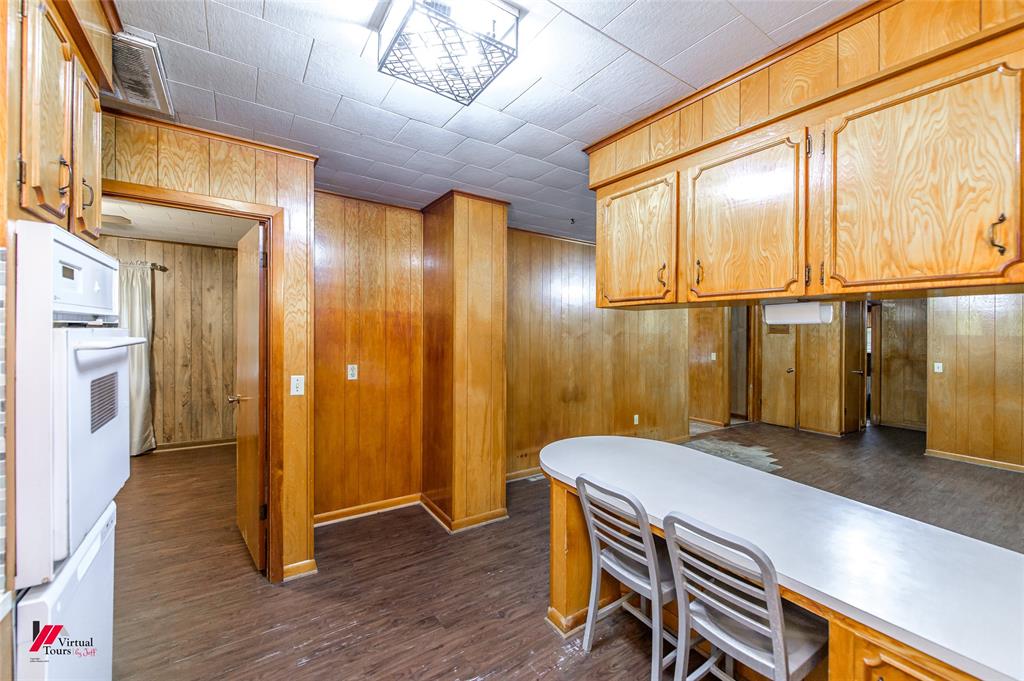 1732 King Orchard Road Sarepta, LA 71071 - Photo 30 of 40 Office space with visible vents, wooden walls, and dark wood finished floors