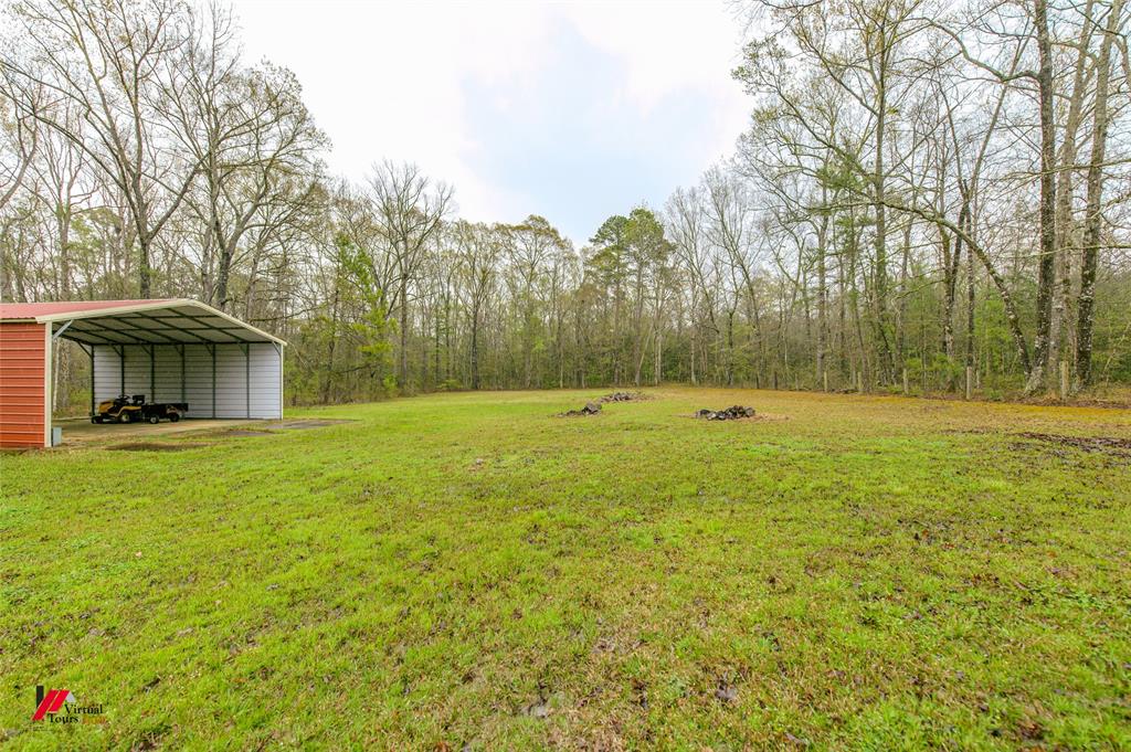 1732 King Orchard Road Sarepta, LA 71071 - Photo 8 of 40 View of yard with a carport