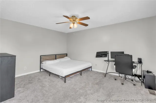 a room with a desk and a window