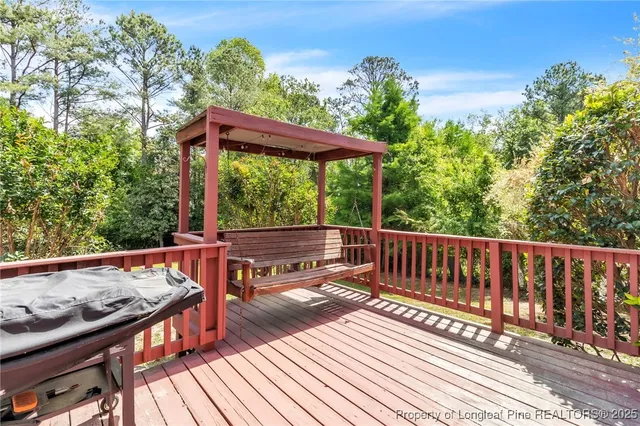 a view of balcony with wooden floor and outdoor seating