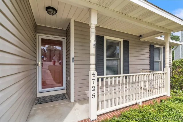 a view of a house with a small yard