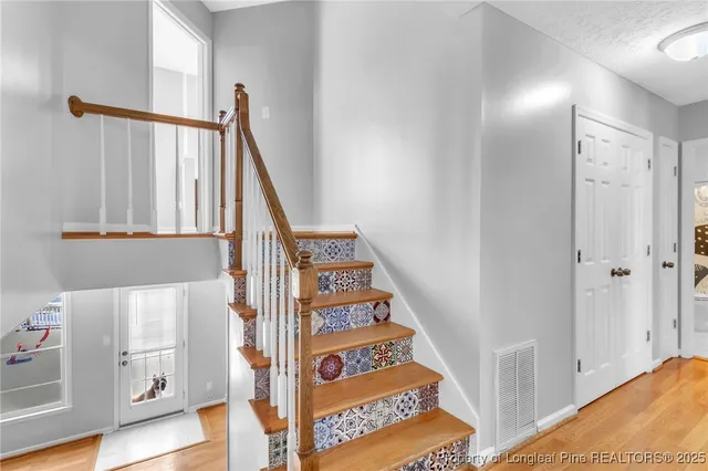 a view of an entryway with wooden floor