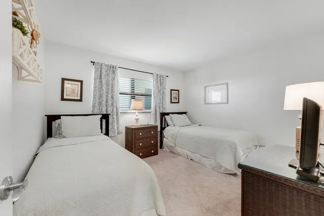 a bathroom with a sink vanity mirror and toilet