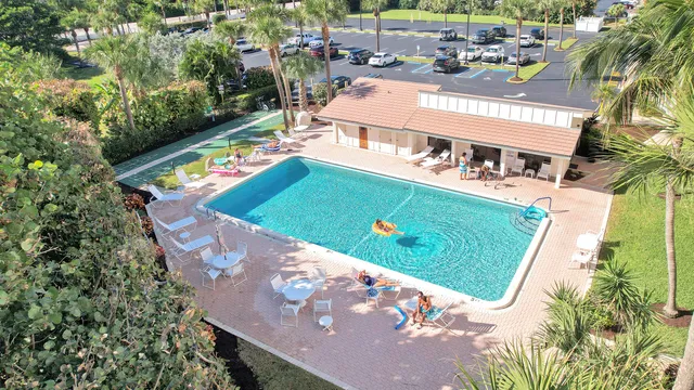 a spacious bedroom with a bed and a flat screen tv