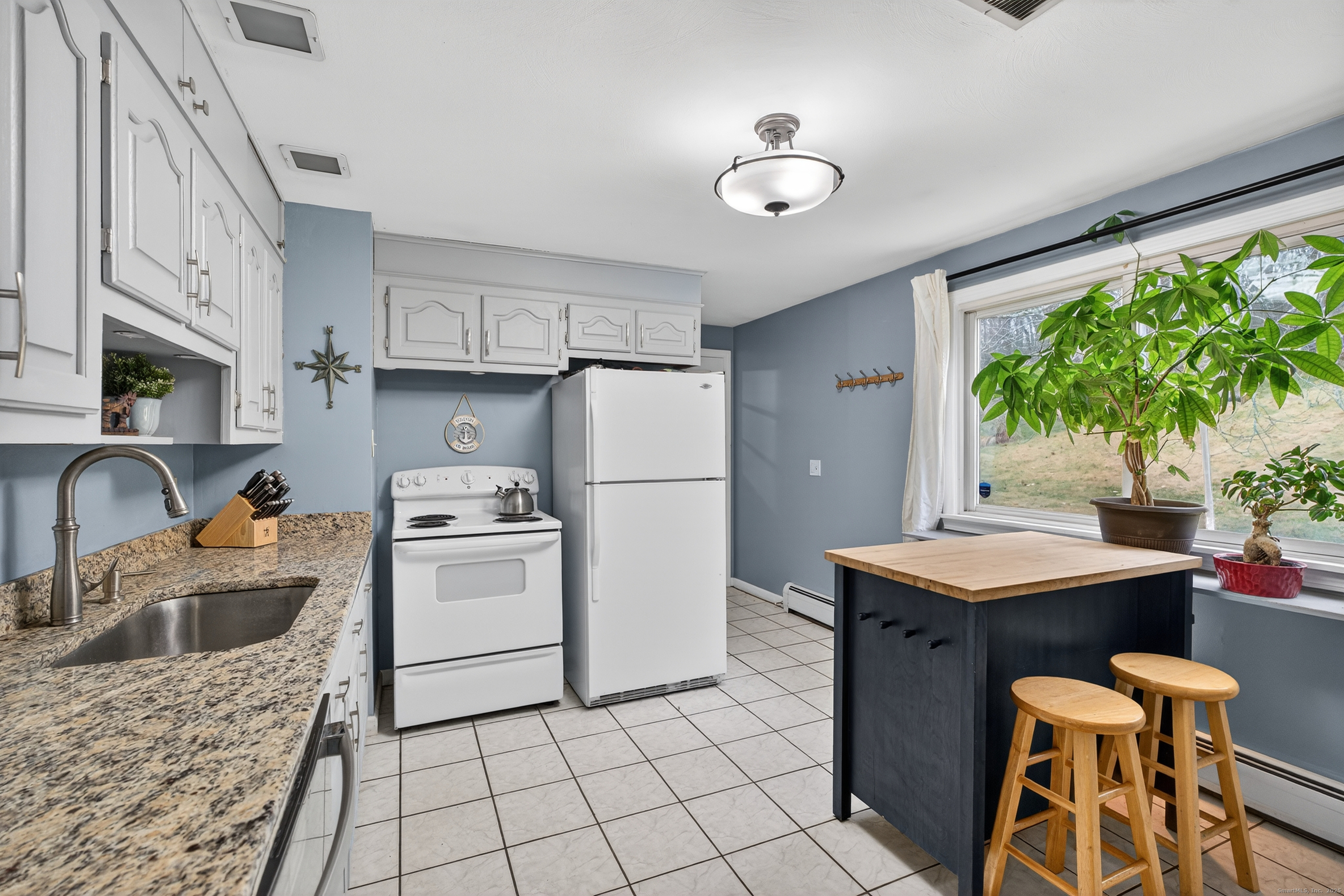 91 Highview Terrace Middletown, CT 06457 - Photo 14 of 39 a kitchen with a sink refrigerator and microwave