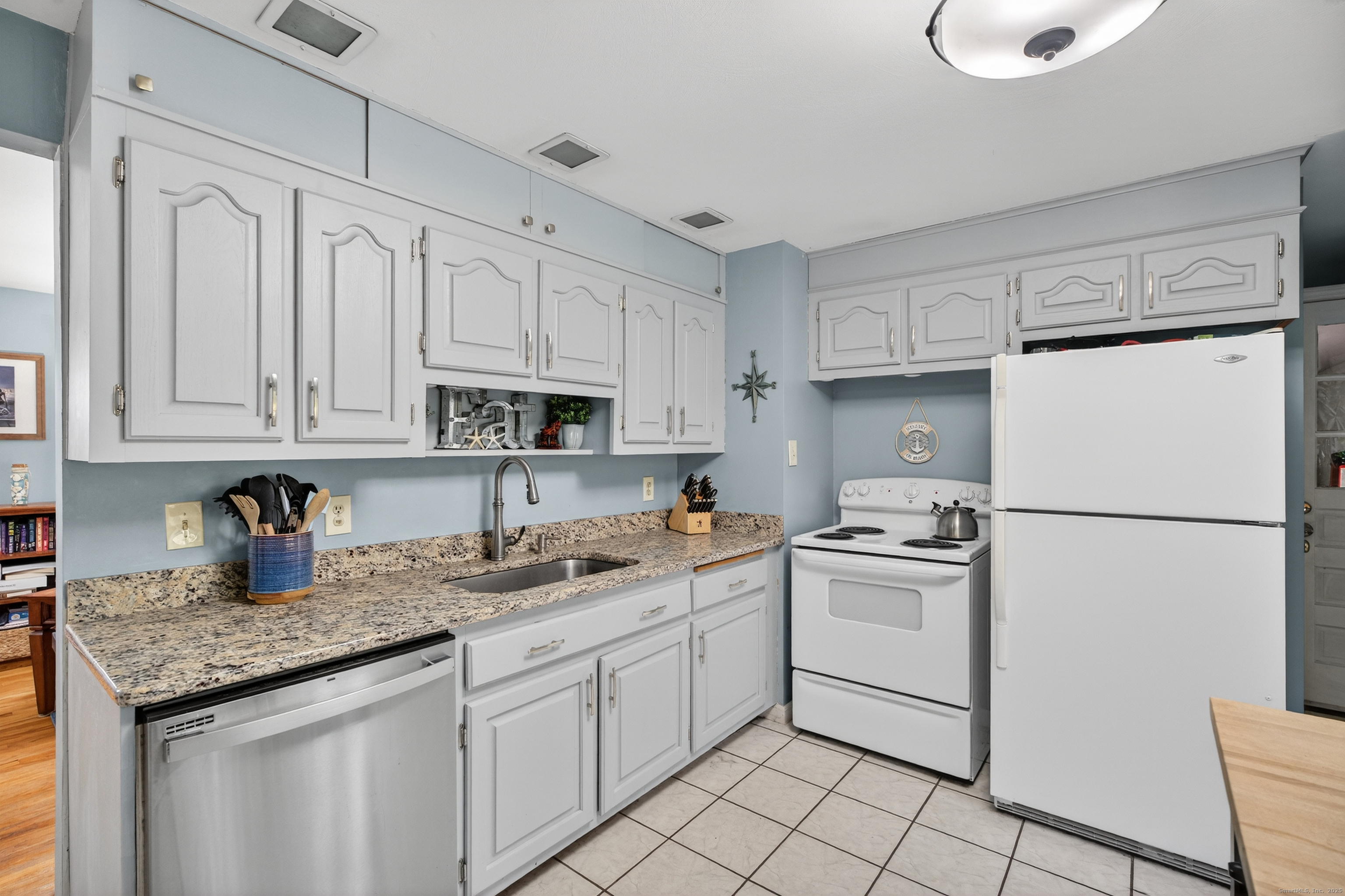 91 Highview Terrace Middletown, CT 06457 - Photo 17 of 39 a kitchen with white cabinets and white appliances