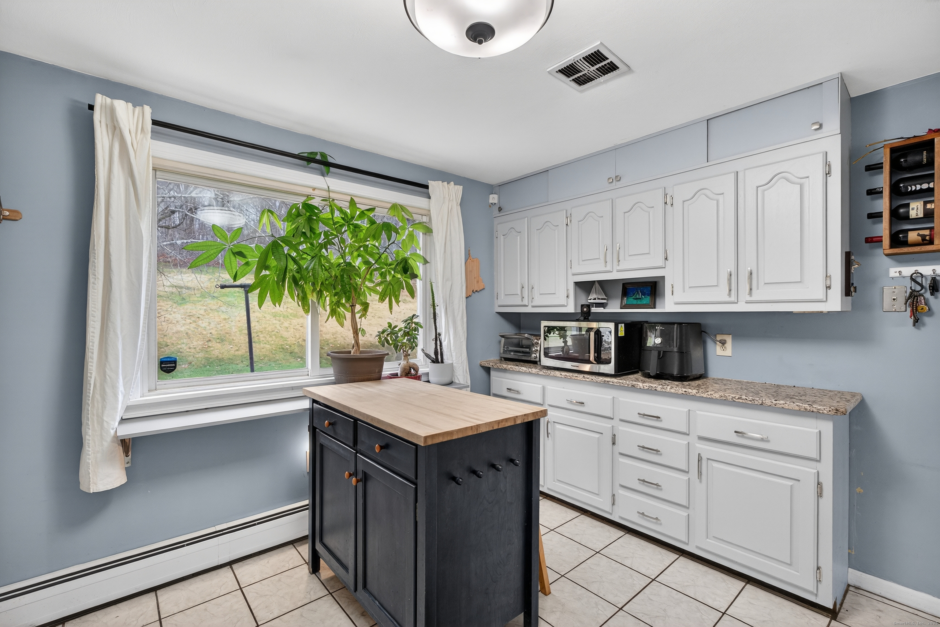 91 Highview Terrace Middletown, CT 06457 - Photo 21 of 39 a kitchen with a sink stove and microwave
