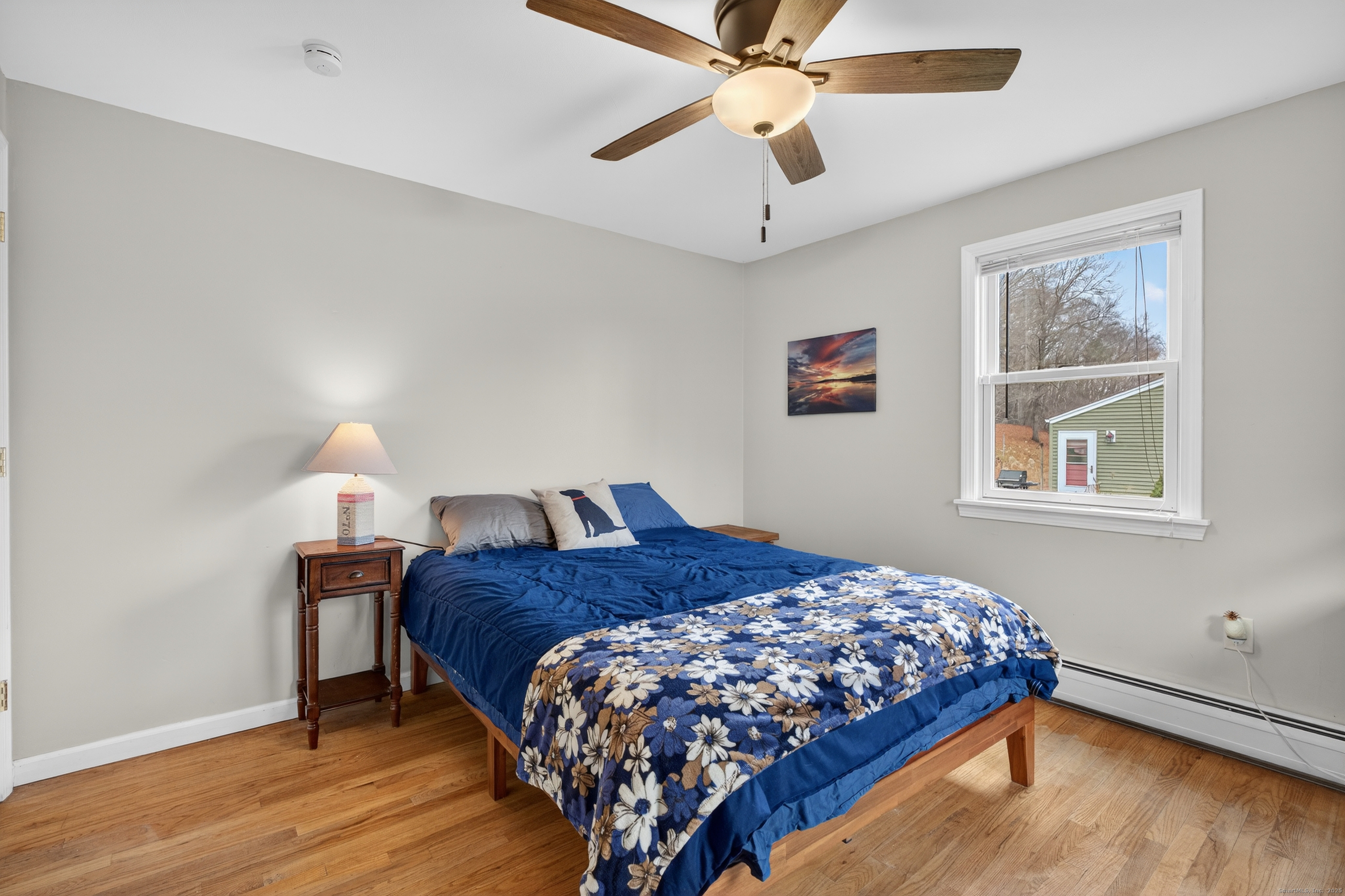 91 Highview Terrace Middletown, CT 06457 - Photo 24 of 39 a bedroom with a bed and wooden floor