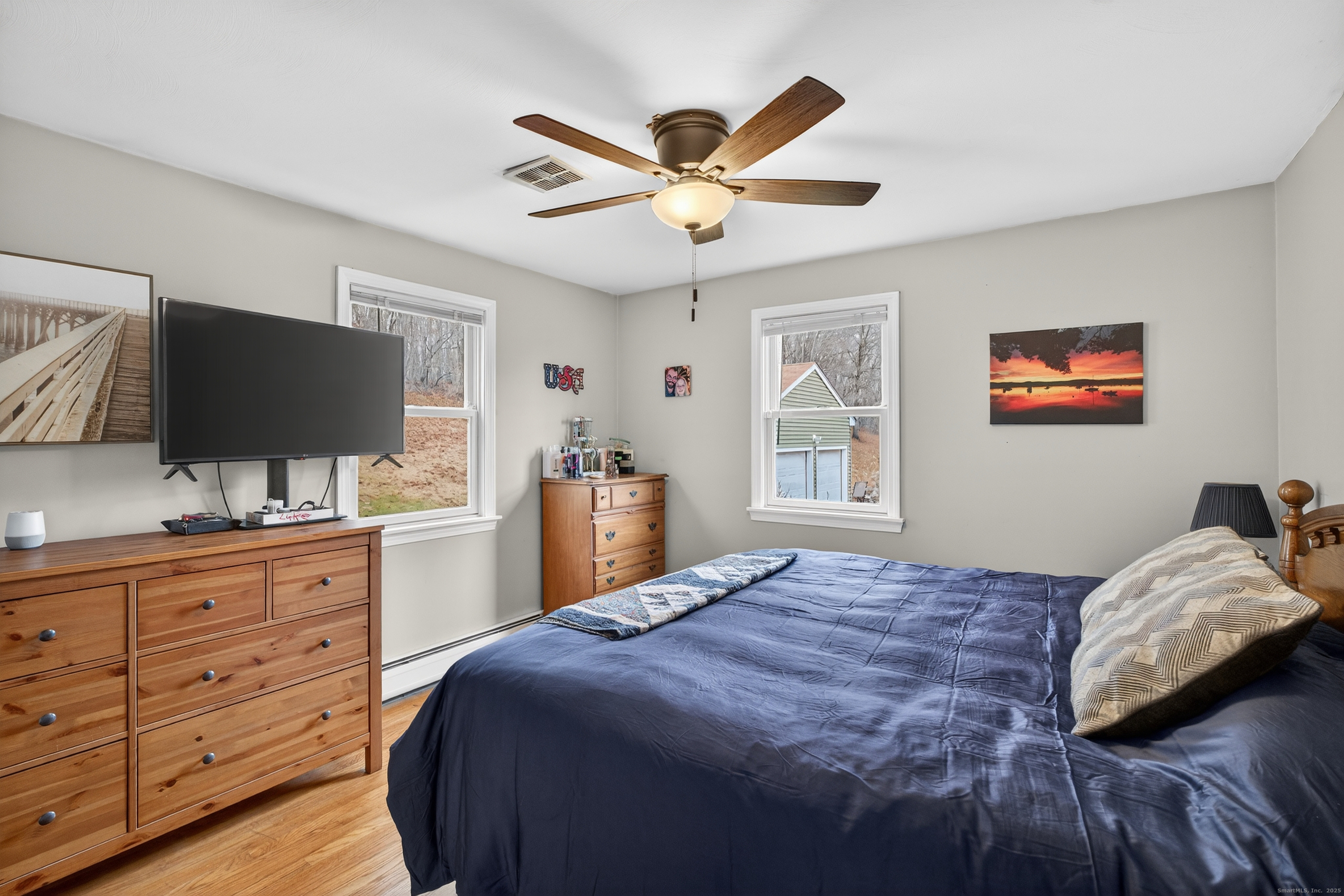 91 Highview Terrace Middletown, CT 06457 - Photo 26 of 39 a bedroom with a bed and a flat screen tv