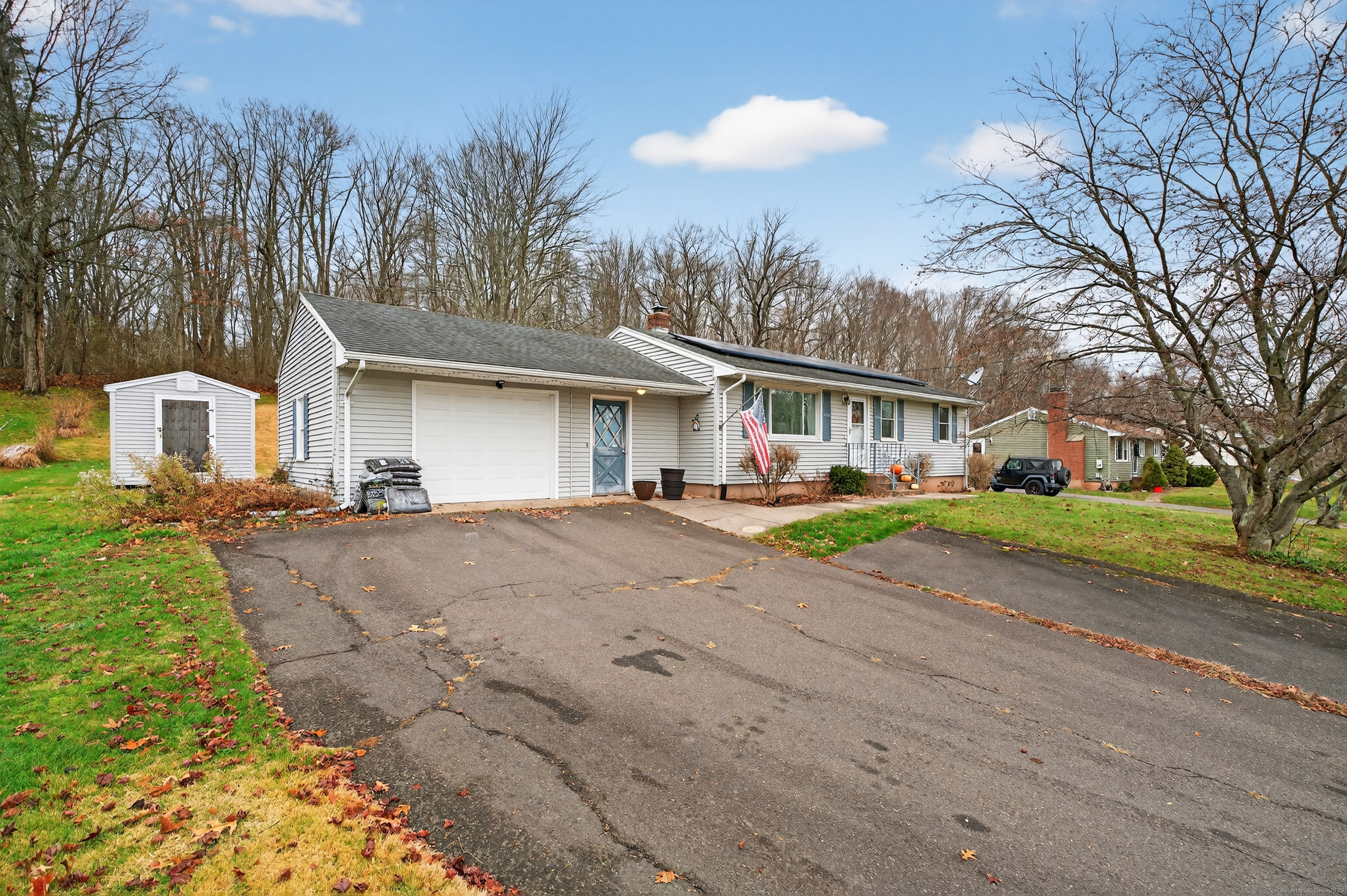 91 Highview Terrace Middletown, CT 06457 - Photo 36 of 39 a view of a house with a yard and large trees