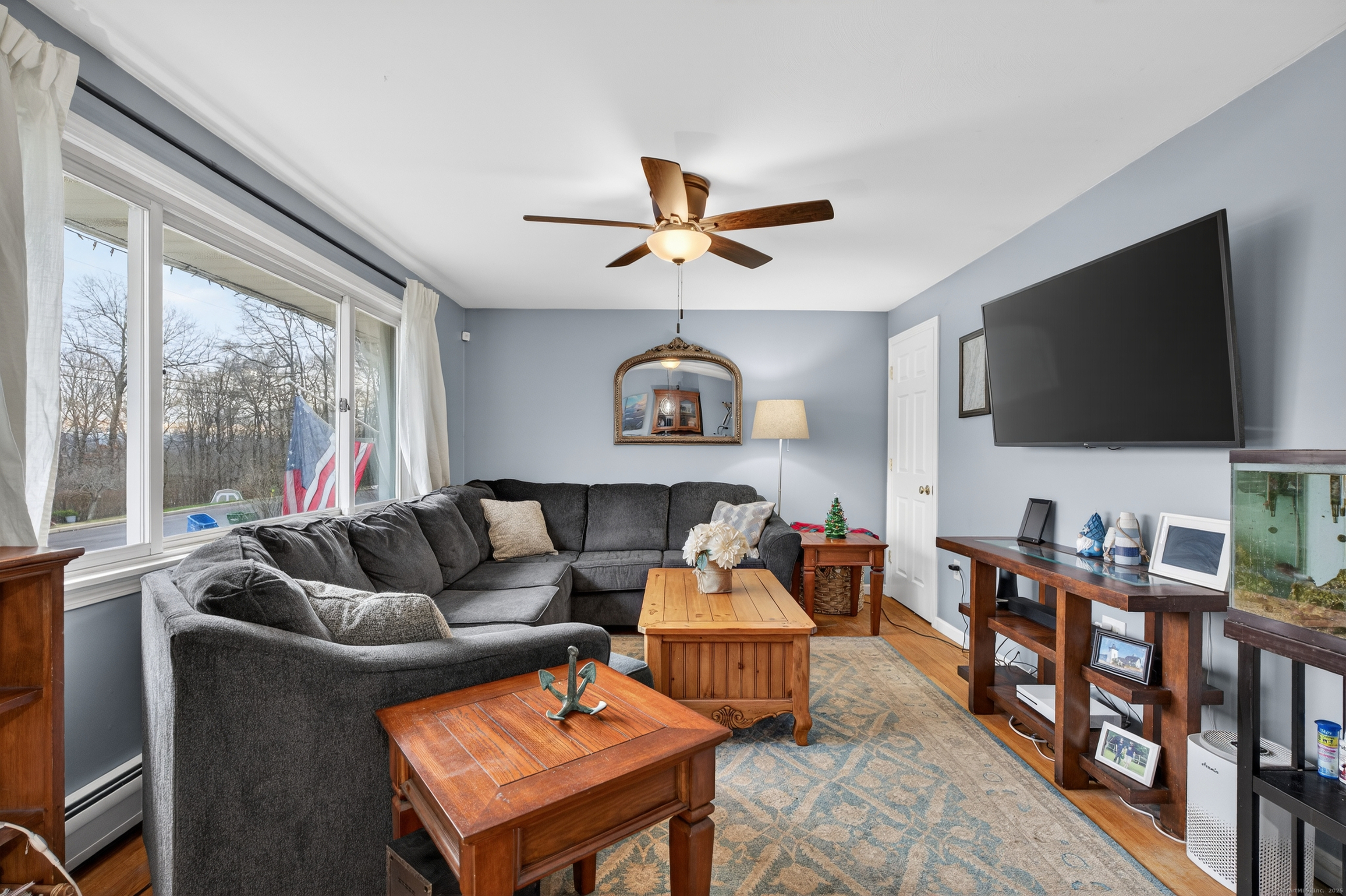 91 Highview Terrace Middletown, CT 06457 - Photo 4 of 39 a living room with furniture and a flat screen tv