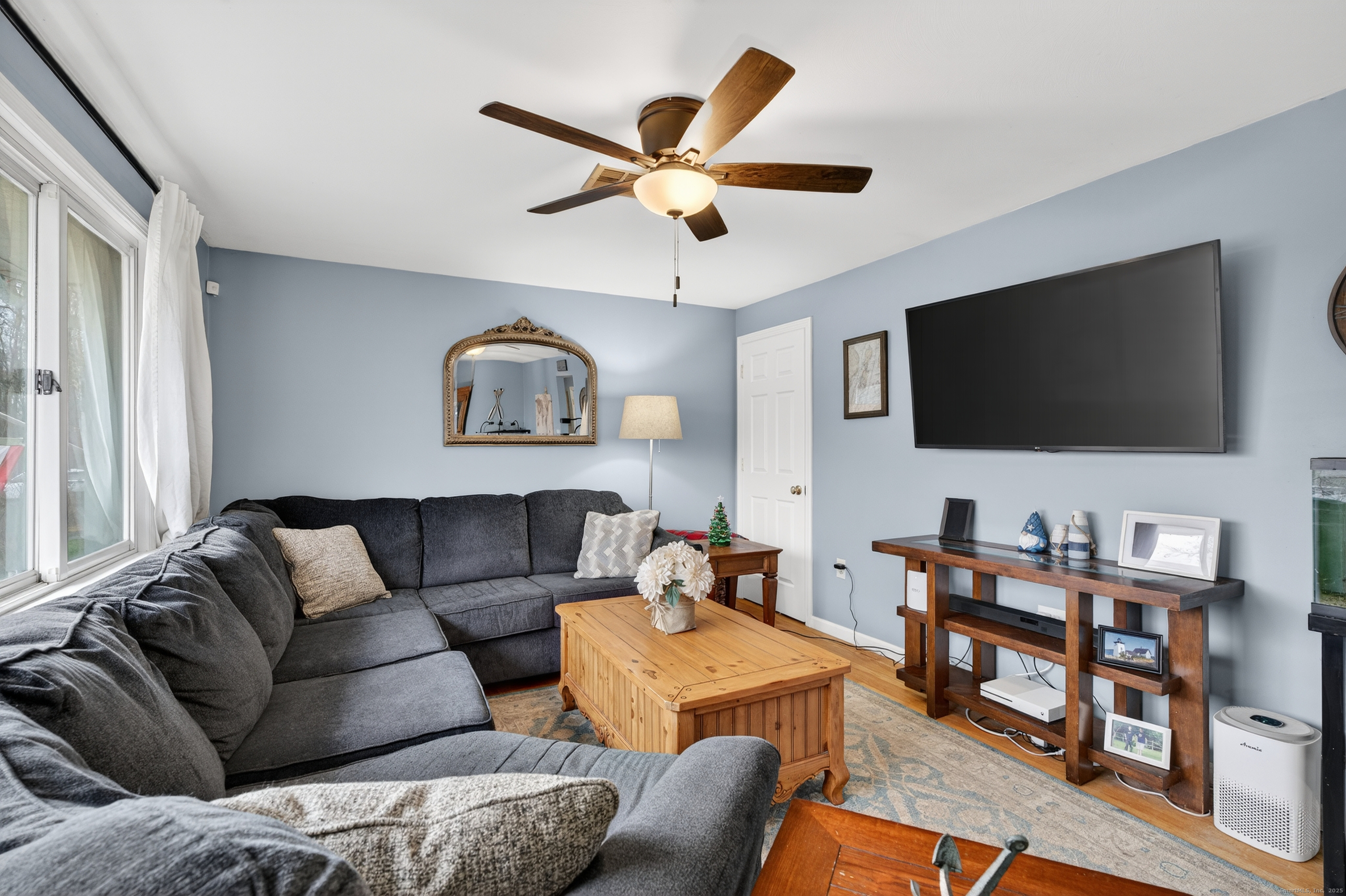 91 Highview Terrace Middletown, CT 06457 - Photo 5 of 39 a living room with furniture and a flat screen tv