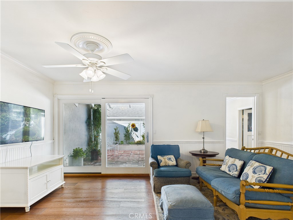 2857 Ellesmere Avenue Costa Mesa, CA 92626 - Photo 14 of 45 a living room with furniture and a wooden floor