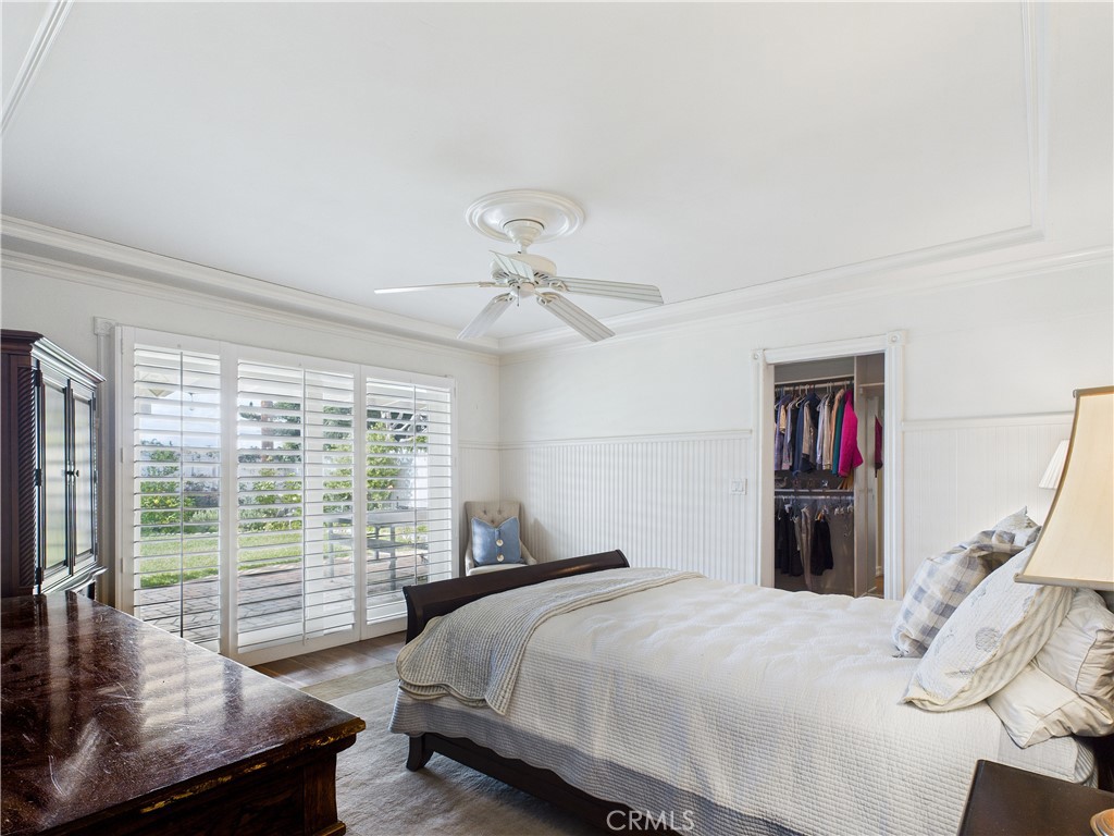 2857 Ellesmere Avenue Costa Mesa, CA 92626 - Photo 16 of 45 a bedroom with a bed and a large window