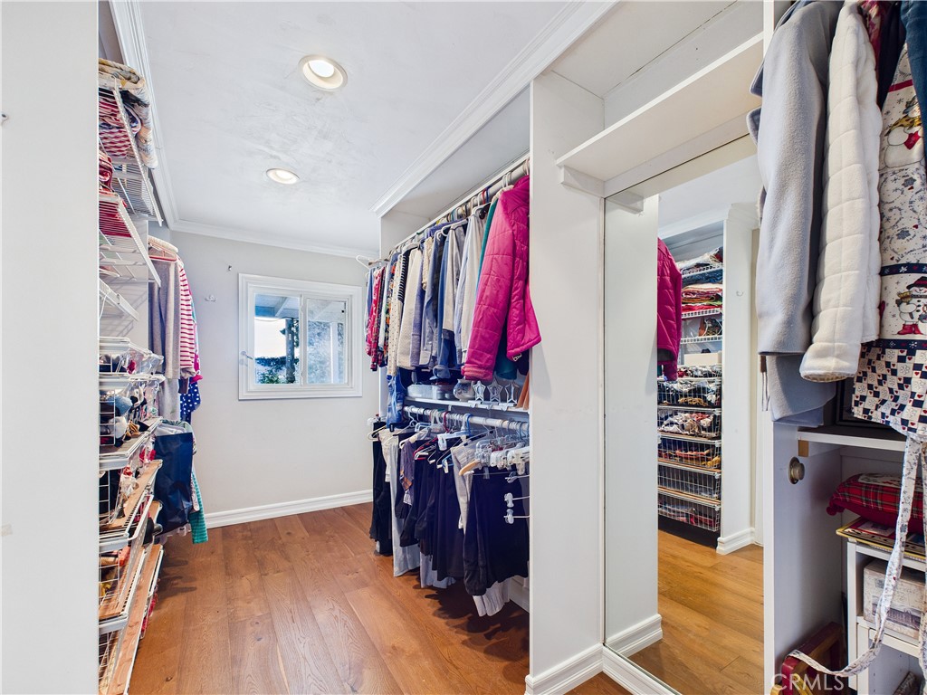 2857 Ellesmere Avenue Costa Mesa, CA 92626 - Photo 19 of 45 a view of walk in closet with clothes and shoes