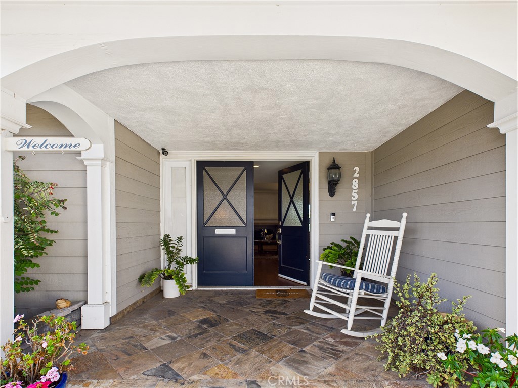 2857 Ellesmere Avenue Costa Mesa, CA 92626 - Photo 2 of 45 a front view of a house with garden