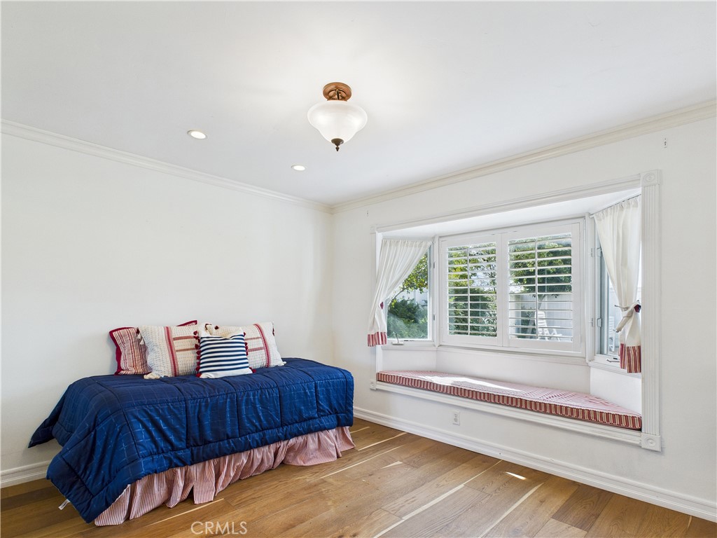 2857 Ellesmere Avenue Costa Mesa, CA 92626 - Photo 22 of 45 a bedroom with furniture and a window