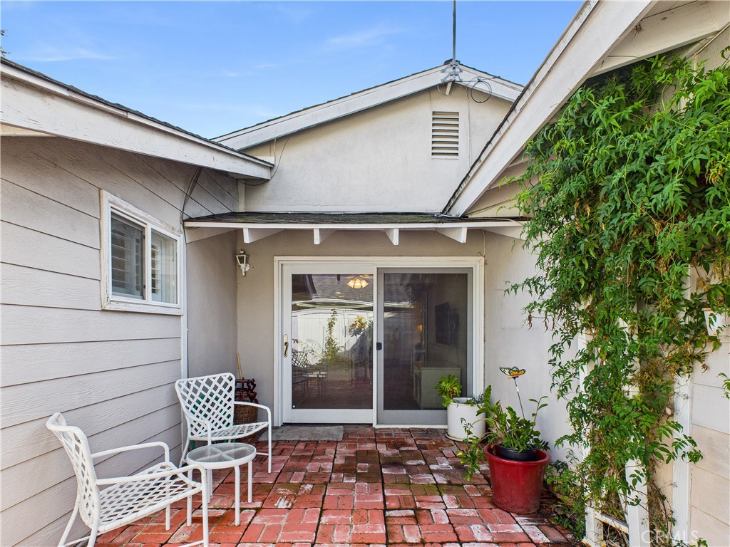 2857 Ellesmere Avenue Costa Mesa, CA 92626 - Photo 31 of 45 a front view of a house with chairs