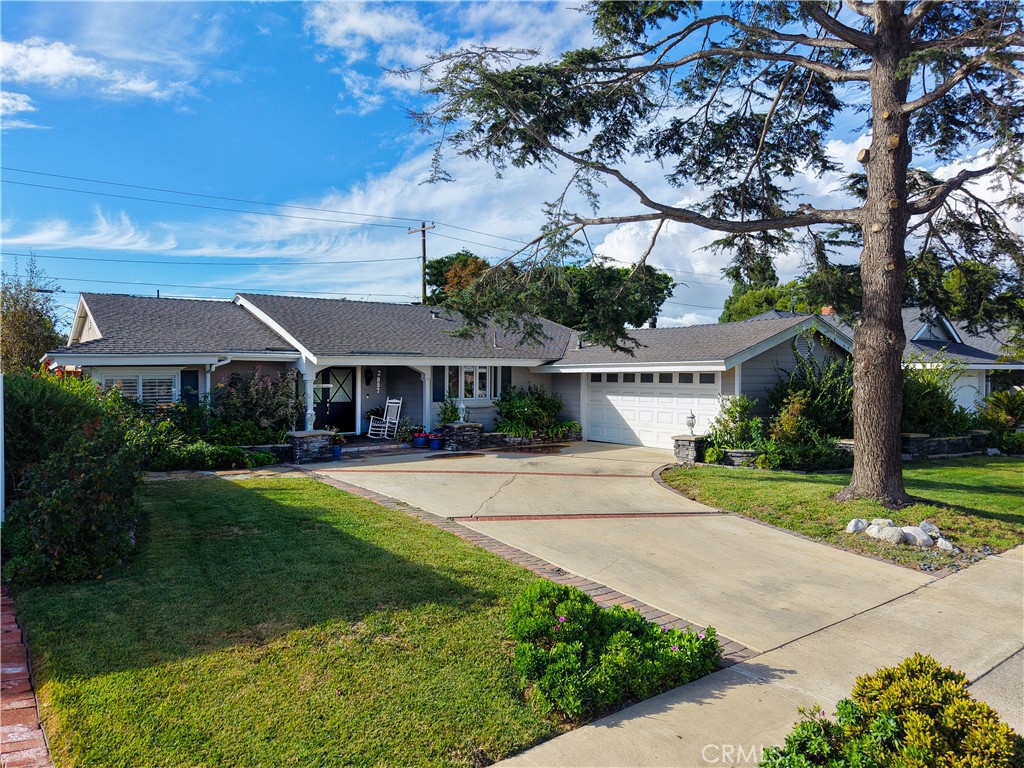 2857 Ellesmere Avenue Costa Mesa, CA 92626 - Photo 32 of 45 front view of a house with a yard