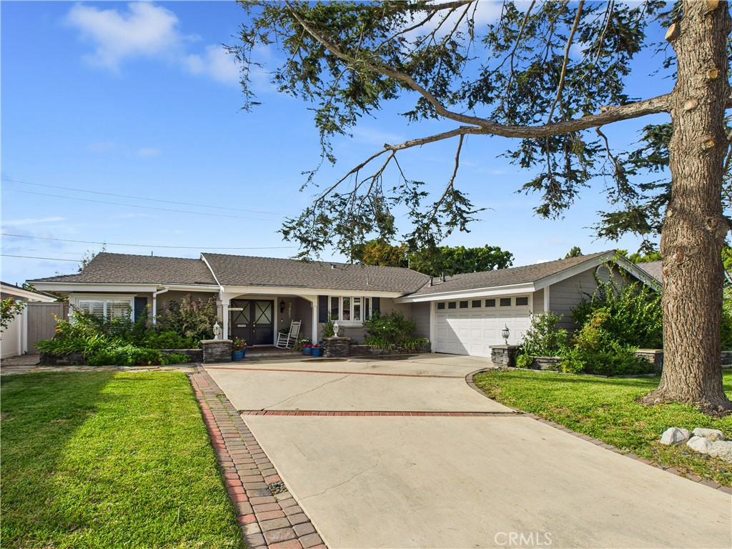 2857 Ellesmere Avenue Costa Mesa, CA 92626 - Photo 34 of 45 a front view of a house with a yard