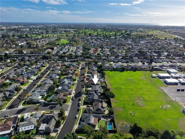 an aerial view of residential houses with outdoor space