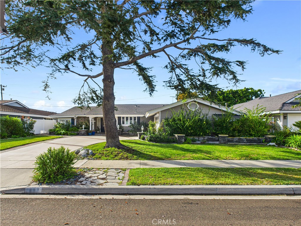 2857 Ellesmere Avenue Costa Mesa, CA 92626 - Photo 45 of 45 a view of a house with a yard and plants