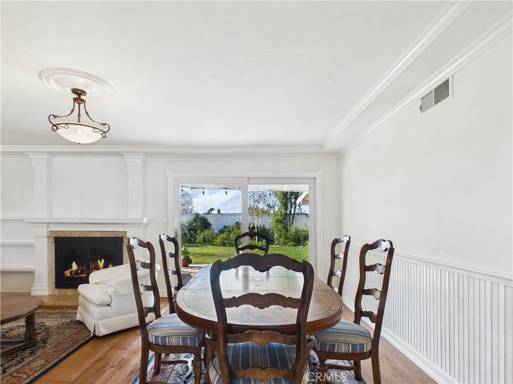 2857 Ellesmere Avenue Costa Mesa, CA 92626 - Photo 9 of 45 a view of a dining room with furniture window and wooden floor
