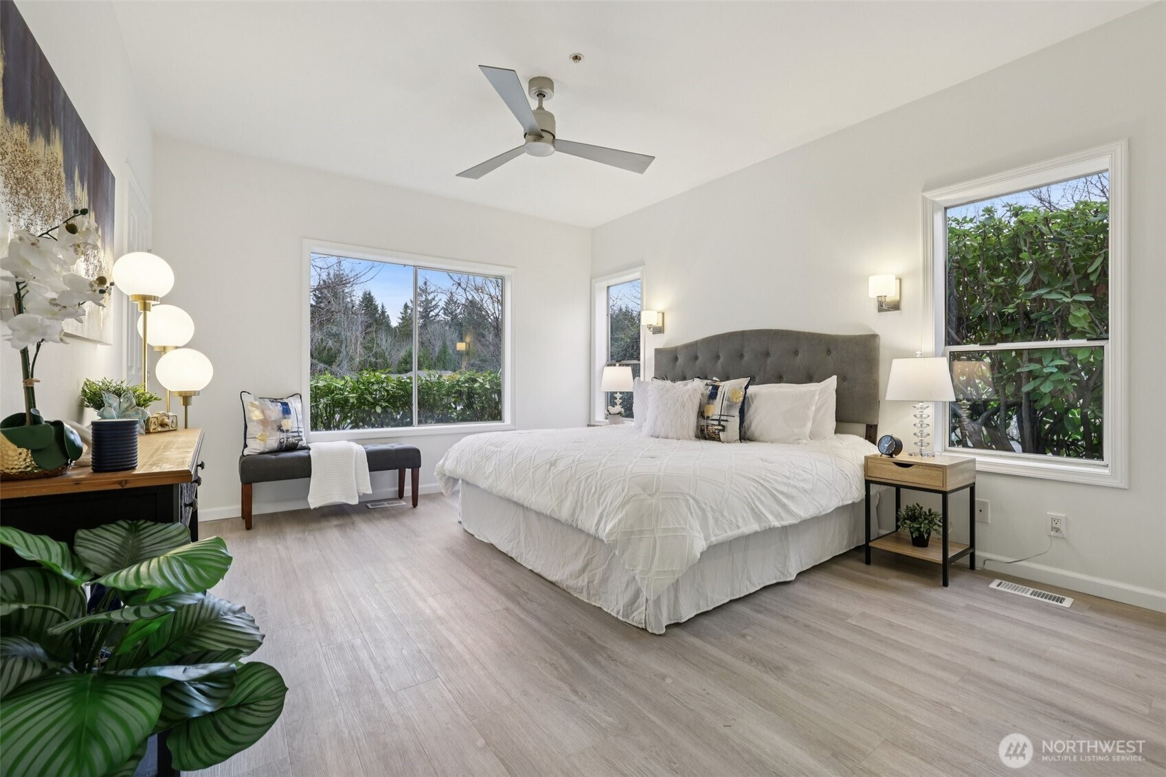 3625 224th Place Southeast Issaquah, WA 98029 - Photo 15 of 39 a bedroom with a bed table flowerpot and window