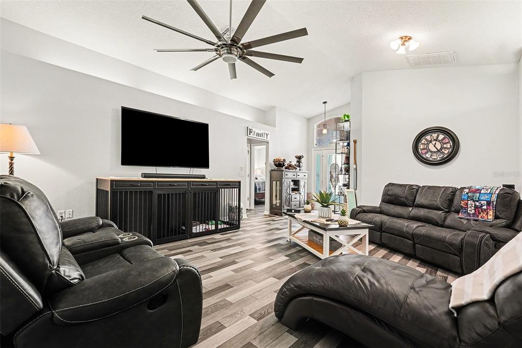 11428 Dorian Court New Port Richey, FL 34654 - Photo 13 of 30 a living room with furniture and a flat screen tv