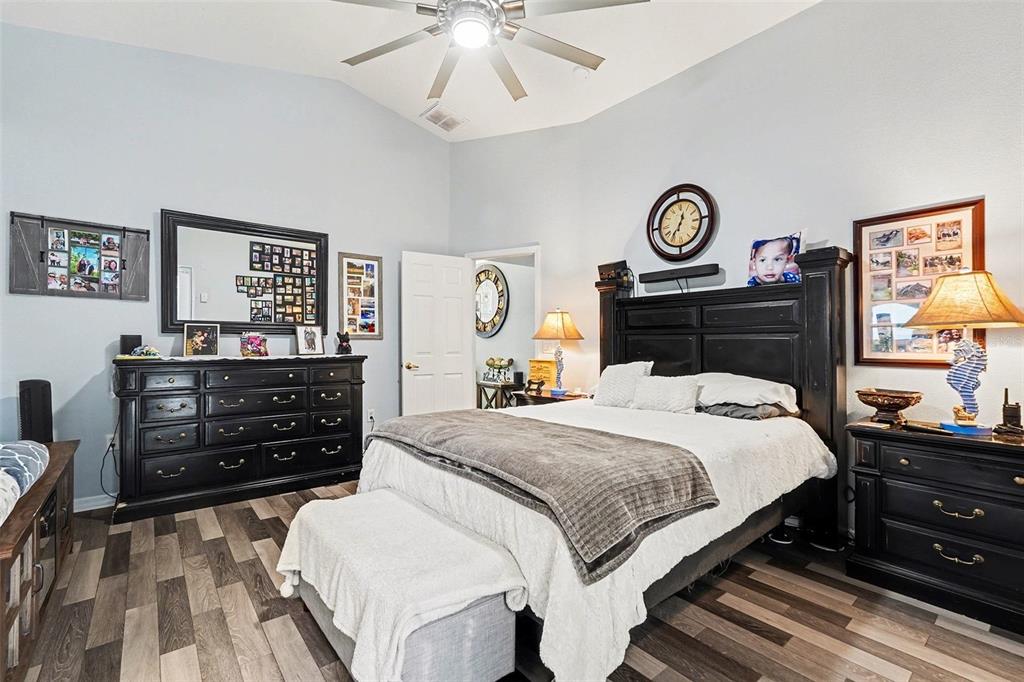 11428 Dorian Court New Port Richey, FL 34654 - Photo 21 of 30 a bedroom with a bed and a dresser