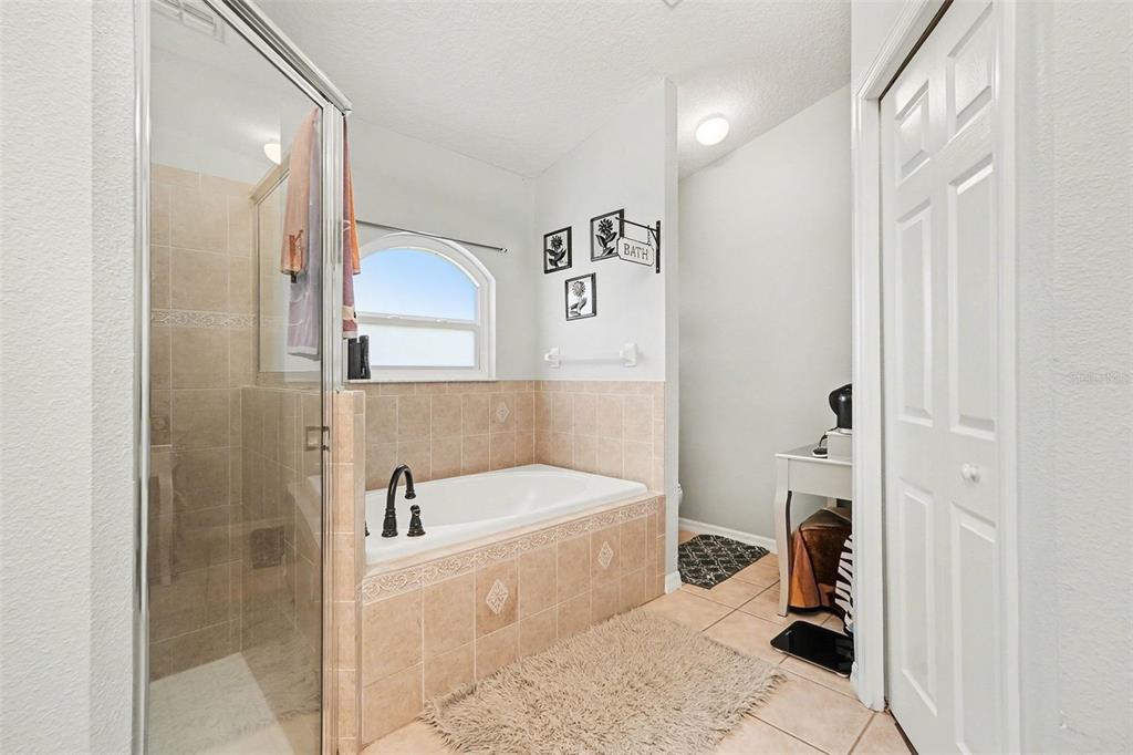 11428 Dorian Court New Port Richey, FL 34654 - Photo 23 of 30 a bathroom with a bathtub and a shower