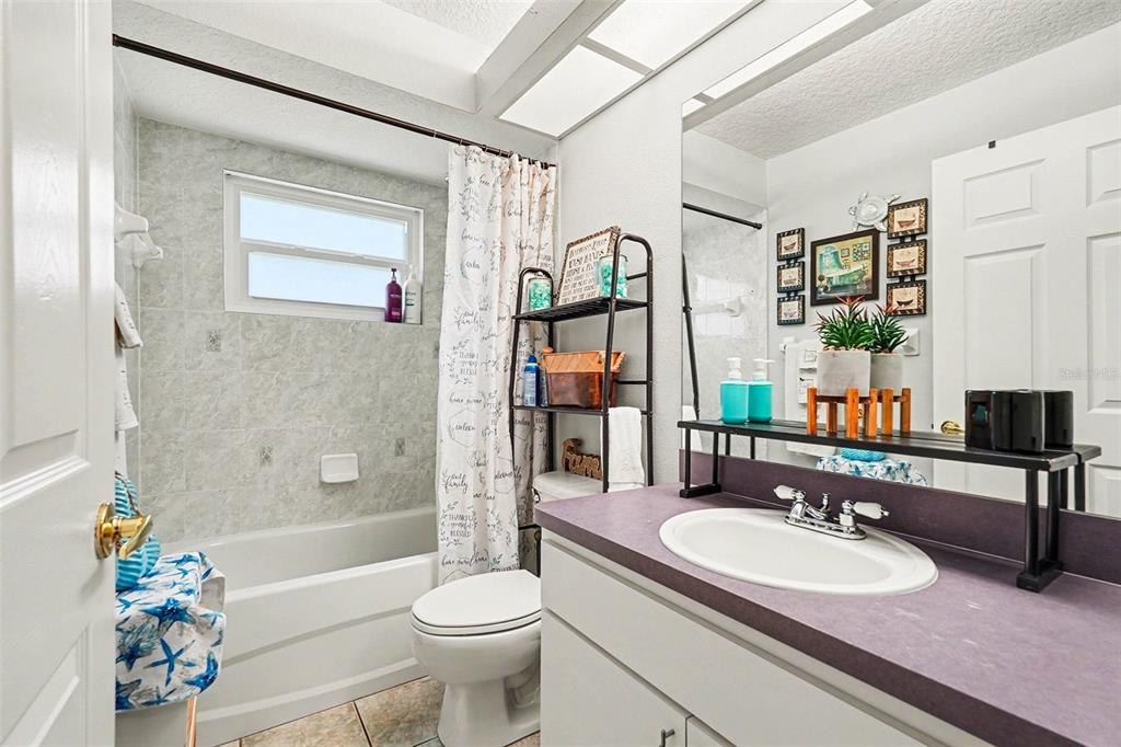 11428 Dorian Court New Port Richey, FL 34654 - Photo 26 of 30 a bathroom with a sink a toilet and shower