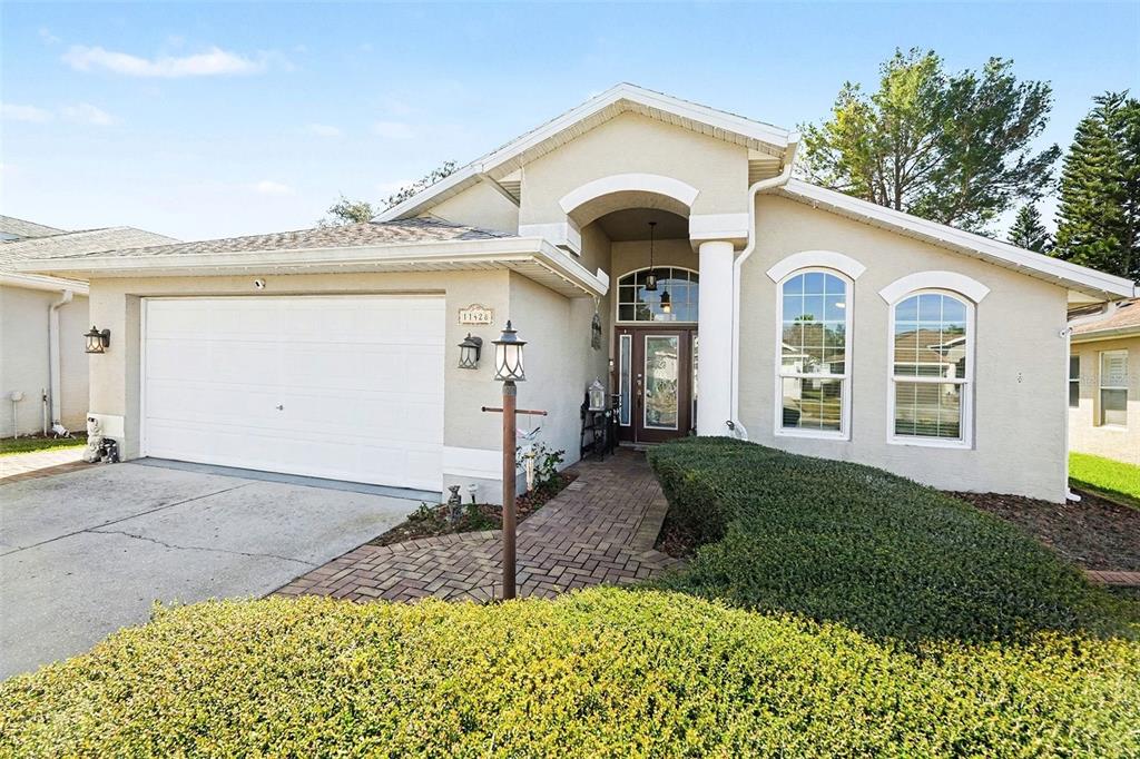 11428 Dorian Court New Port Richey, FL 34654 - Photo 5 of 30 a front view of a house with a yard