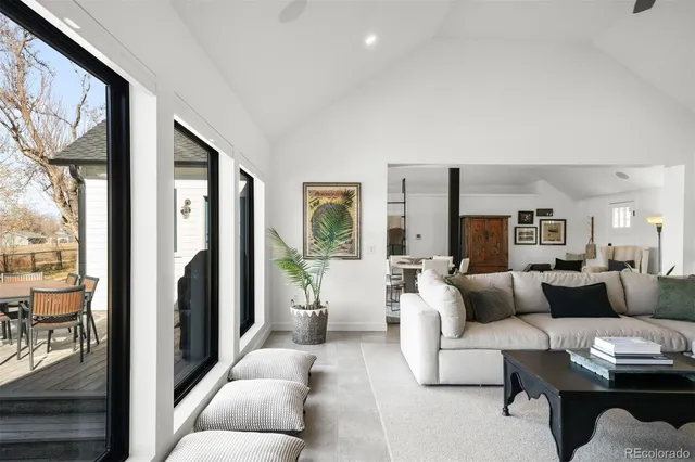 a bed room with a bed and a large window