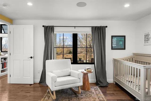 a bathroom with a toilet and a shower curtain