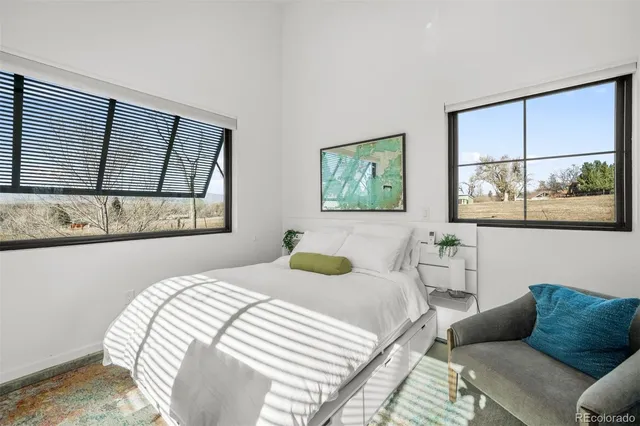 a view of a lake with couches and table