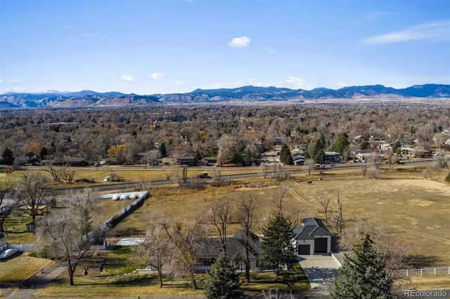a swimming pool view with a outdoor seating