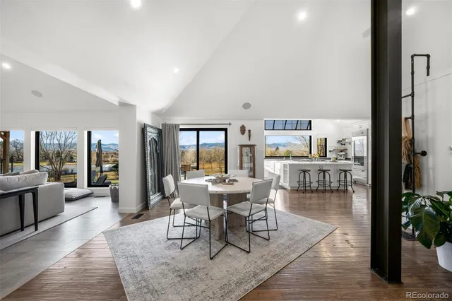 a view of a dining room with furniture and window