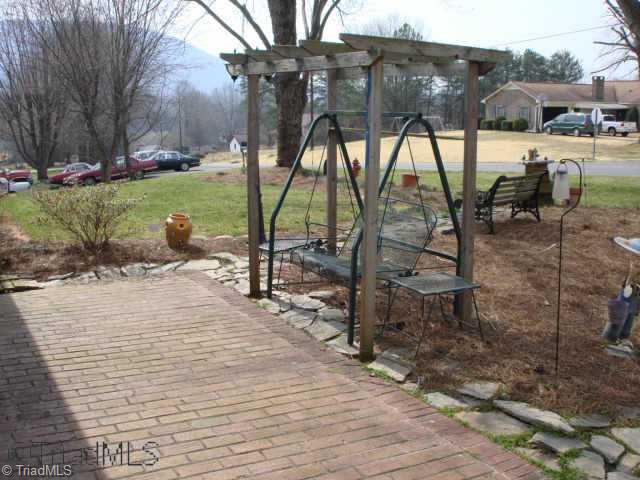 151 Buckingham Road Pinnacle, NC 27043 - Photo 8 of 9 Other. Front Porch/Swing