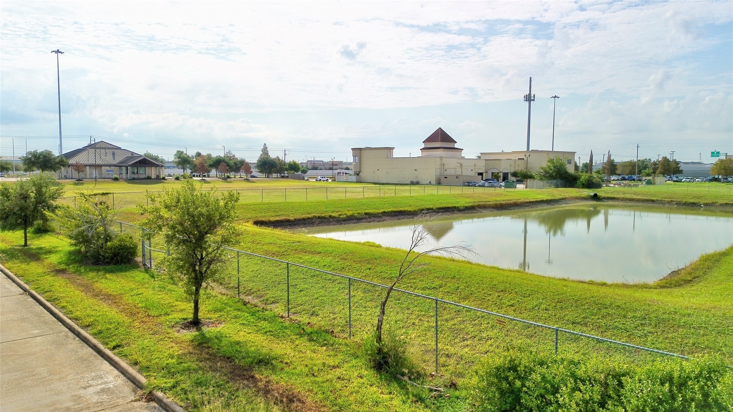 4242 Keith Road Pasadena, TX 77505 - Photo 14 of 15 a view of a lake with a garden
