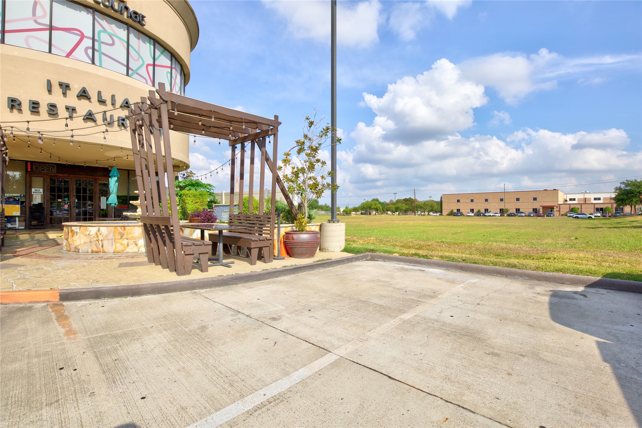 4242 Keith Road Pasadena, TX 77505 - Photo 15 of 15 a view of a lake with a building in the background