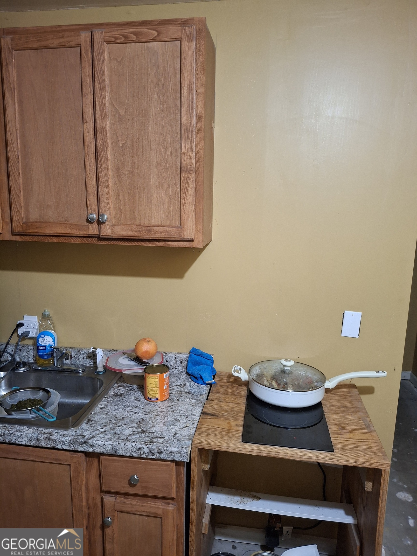 3284 Clubside View Court Southwest Snellville, GA 30039 - Photo 8 of 10 a table with a sink and a stove