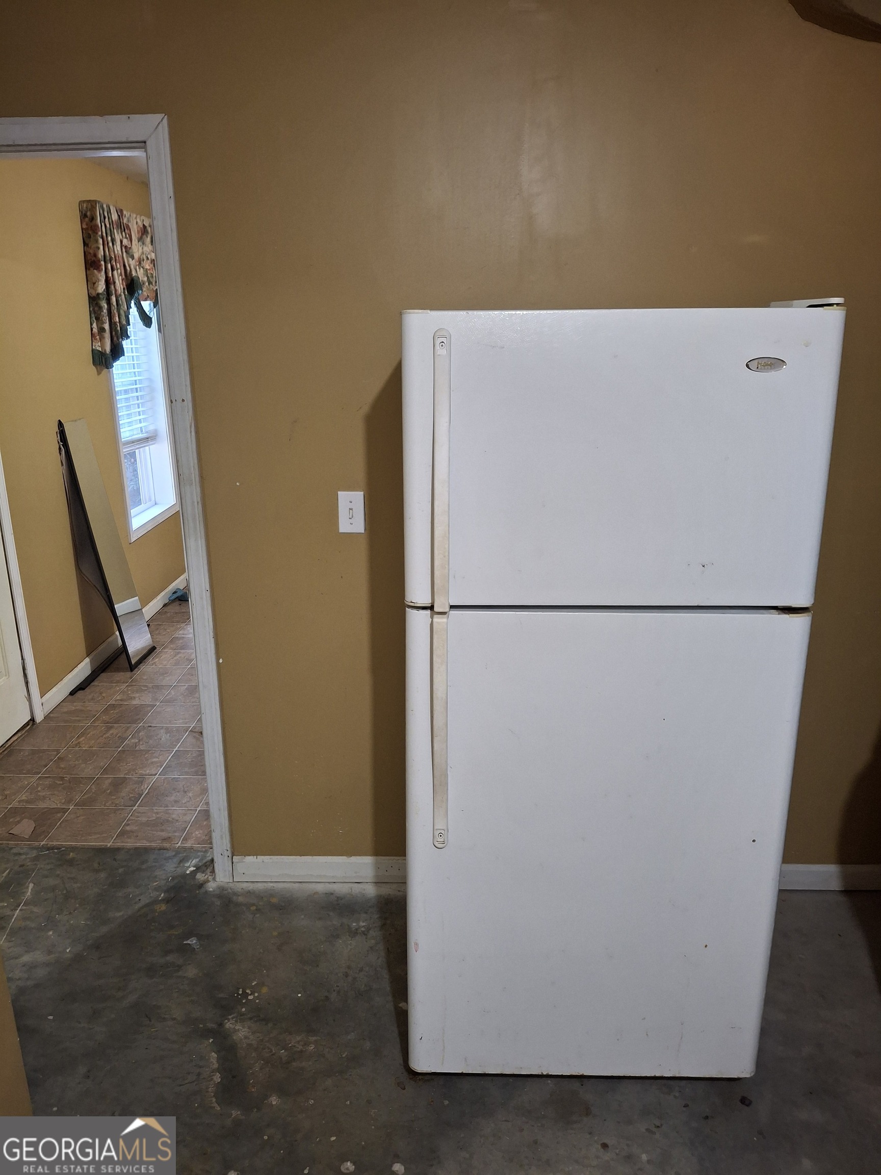 3284 Clubside View Court Southwest Snellville, GA 30039 - Photo 9 of 10 a view of a refrigerator in a kitchen